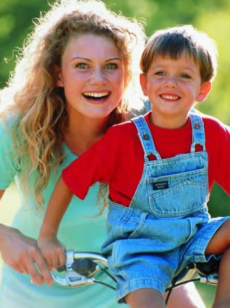 young mom and son on bike image